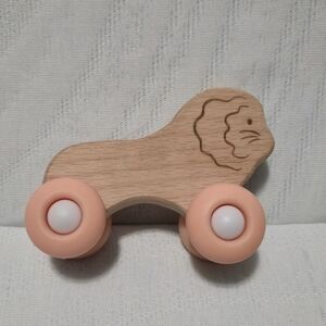 Wooden Lion Push Toy with Peach Silicone Wheels